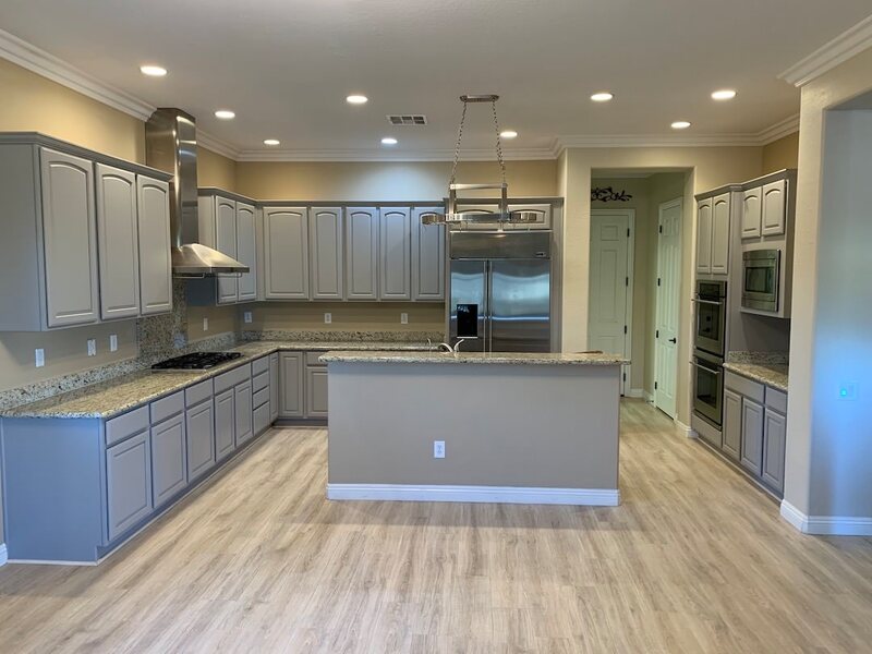grey-kitchen-with-island-and-stainless-appliances Where a Respray Ends and a New Kitchen Begins - Not Included / Costed Separately