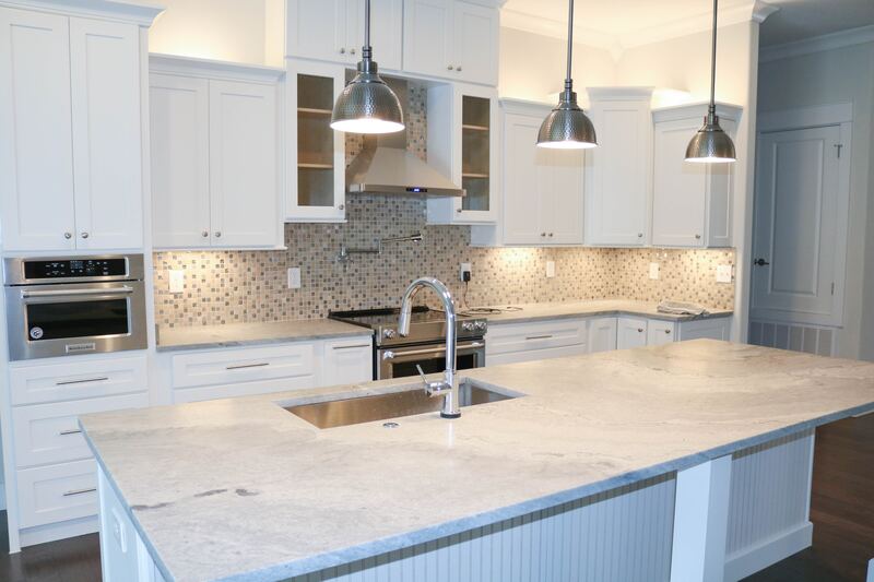 white-kitchen-mosaic-tile-backsplash-granite-counters What's Included When You Book a Backsplash Fitting