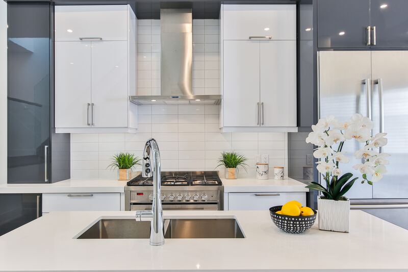 white-quartz-countertop-chrome-tap-glossy-cabinets Stone and Sintered Worktops We Supply and Fit in West Bridgford