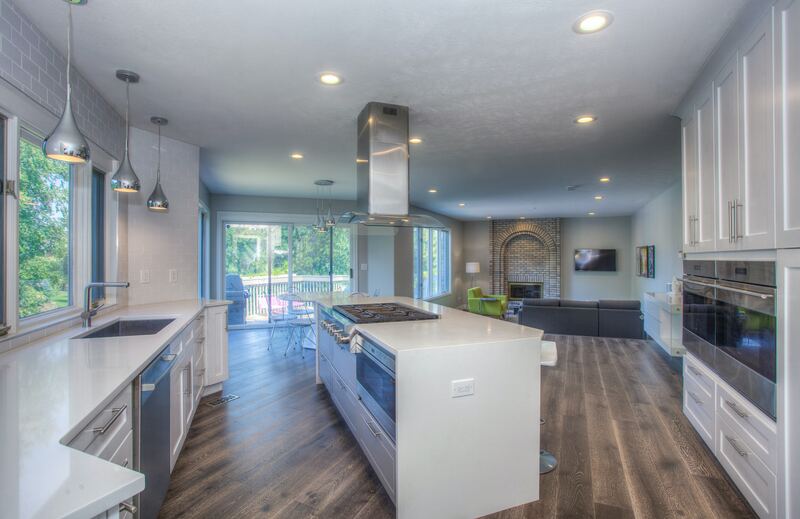 white-quartz-island-stainless-appliances-wood-flooring Qualified Trades Behind Every Appliance We Fit
